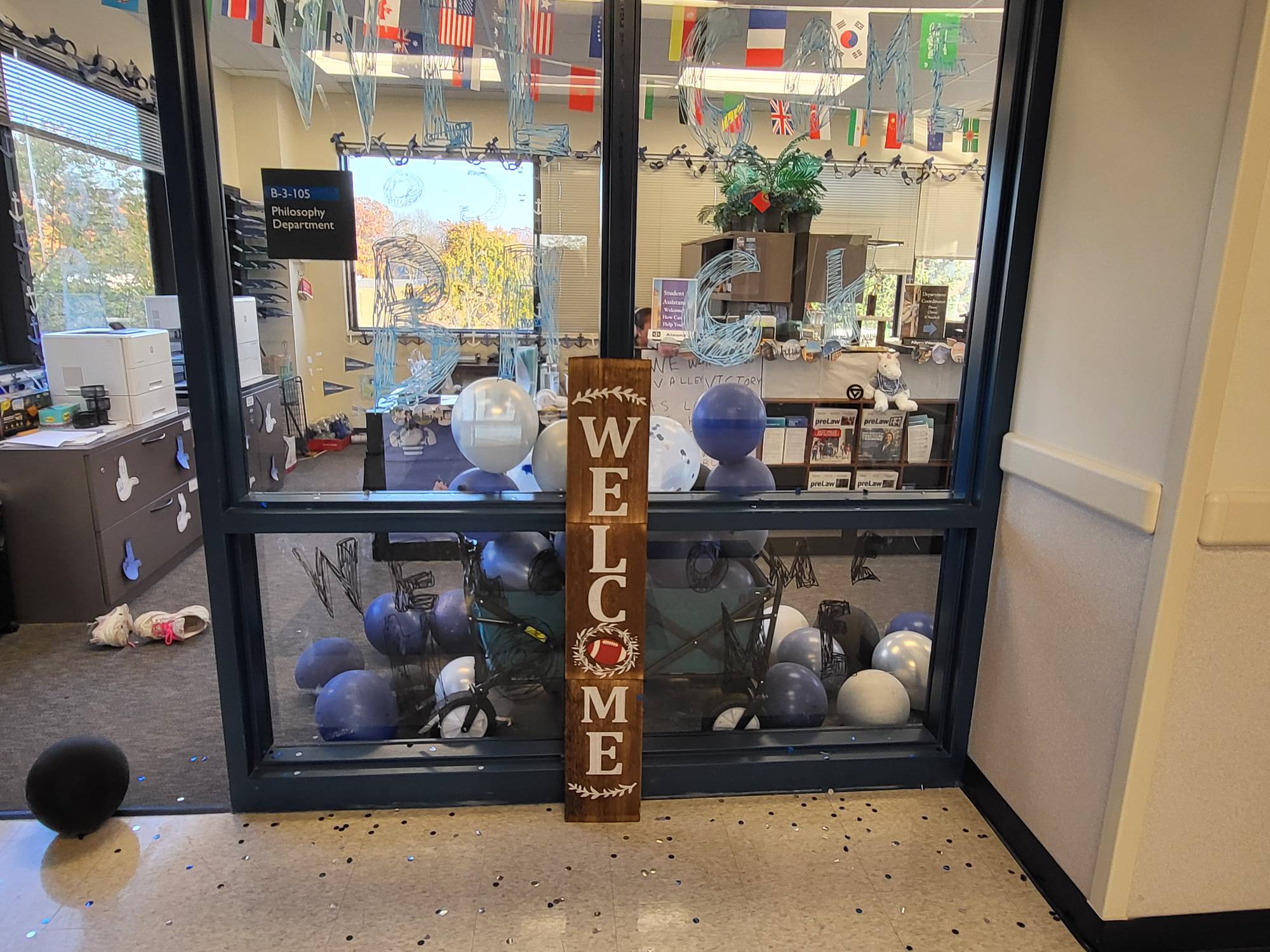 Philosophy department Homecoming decor, glass panes in entry way with window paint